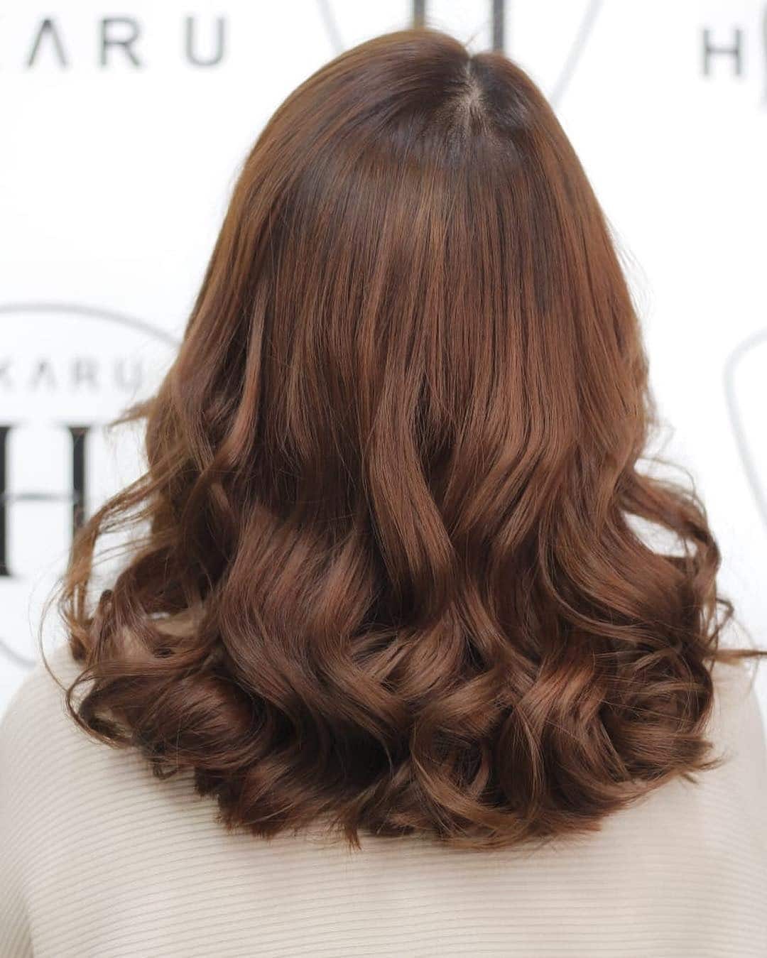 20. Warm Chestnut Mahogany Hair with Bouncy Shoulder-Length Curls - Mahogany Hair Color
