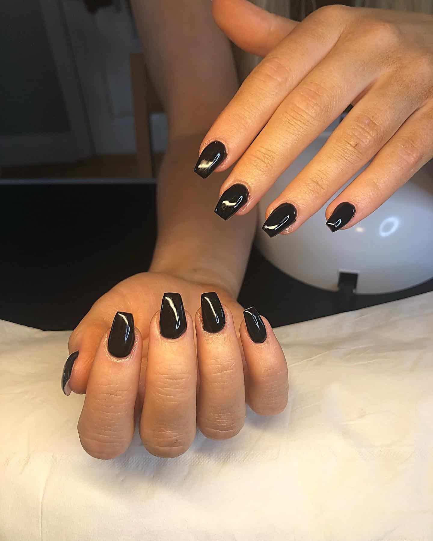 5. Short Glossy Black Coffin Nails - black coffin nail ideas