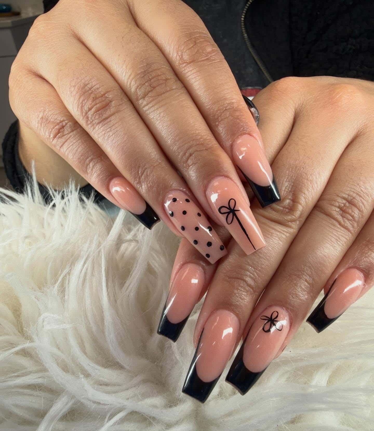 11. Black French Tip Coffin Nails with Bows and Polka Dots - black coffin nail ideas