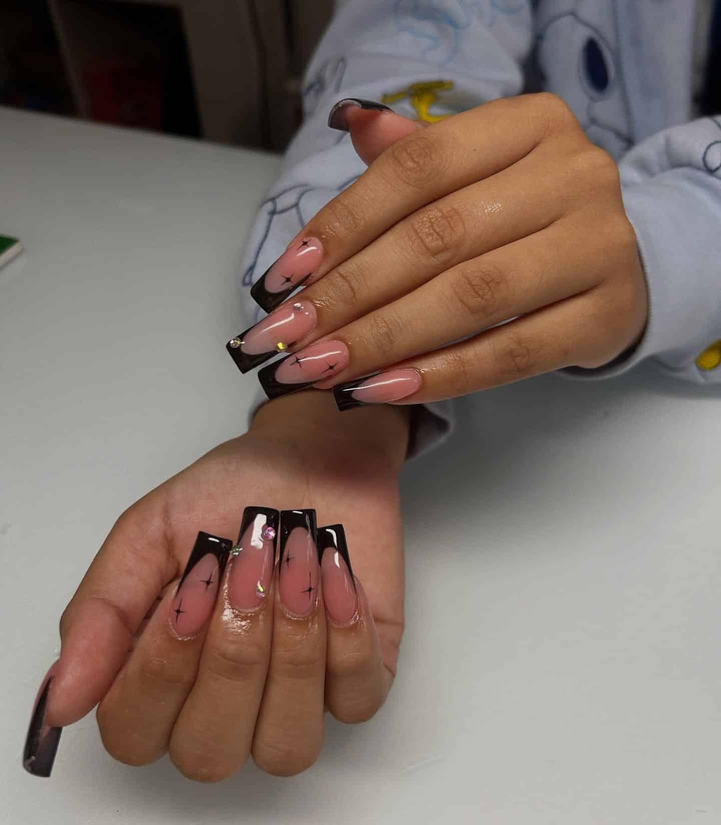 12. Black Coffin French Tip Nails with Starbursts and Rhinestones - black coffin nail ideas