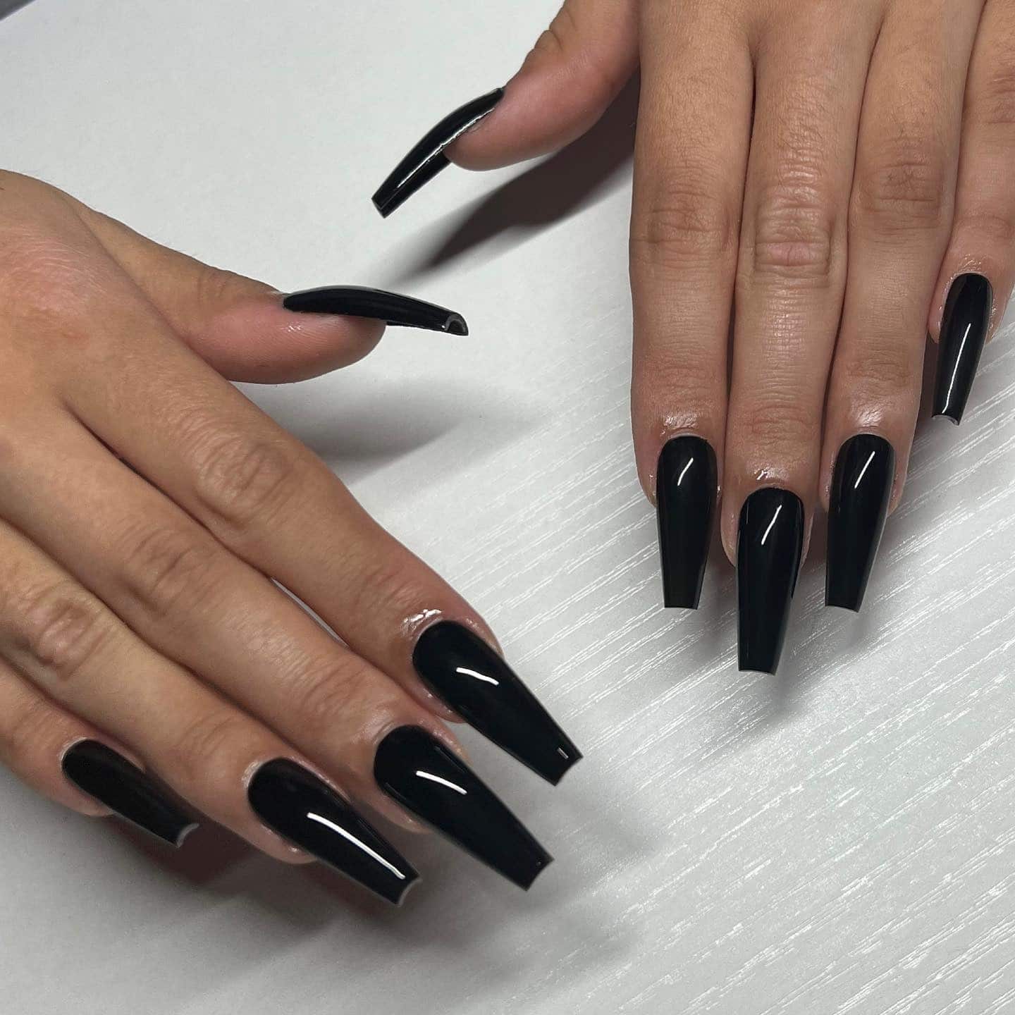 15. Long Jet Black Coffin Nails with Glossy Finish - black coffin nail ideas