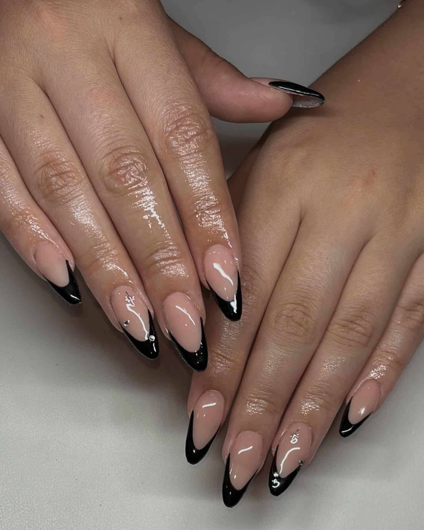 3. Black V-French Stiletto Nails with Silver Rhinestones - black french nail ideas