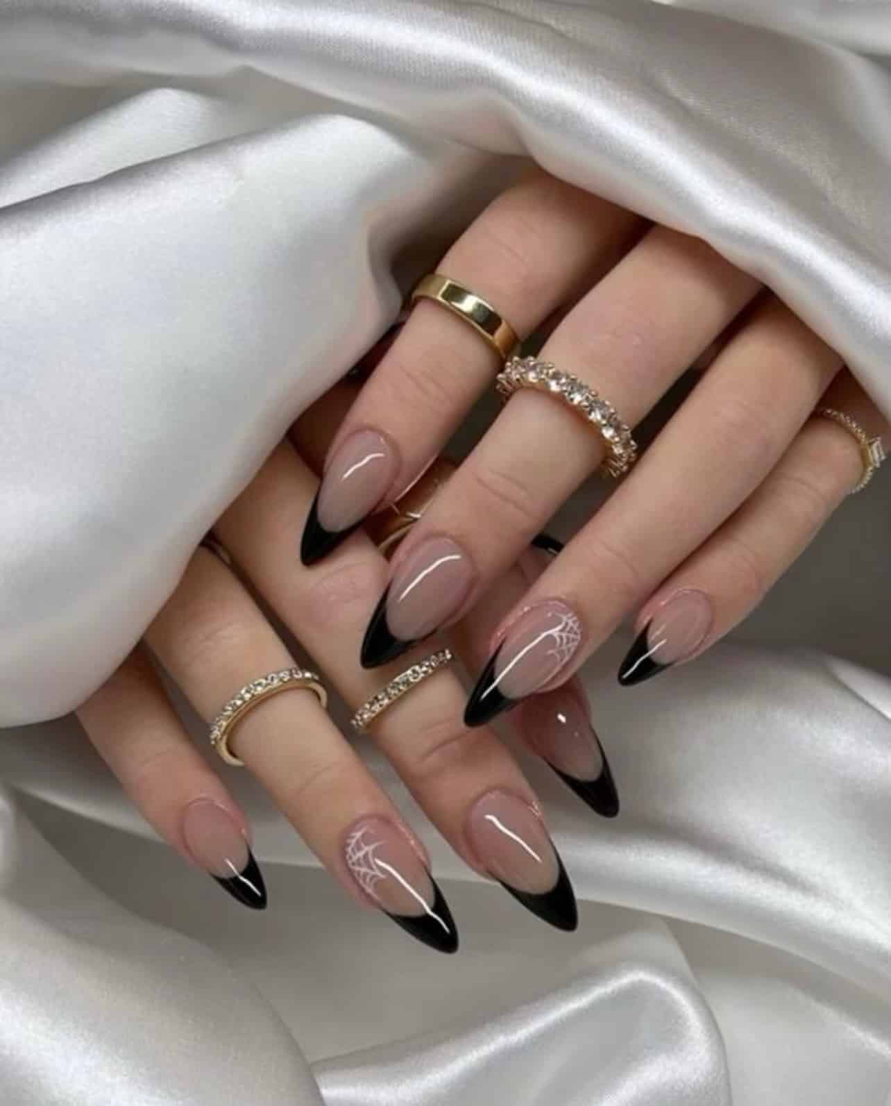 5. Black French Almond Nails with White Spiderweb Art - black french nail ideas