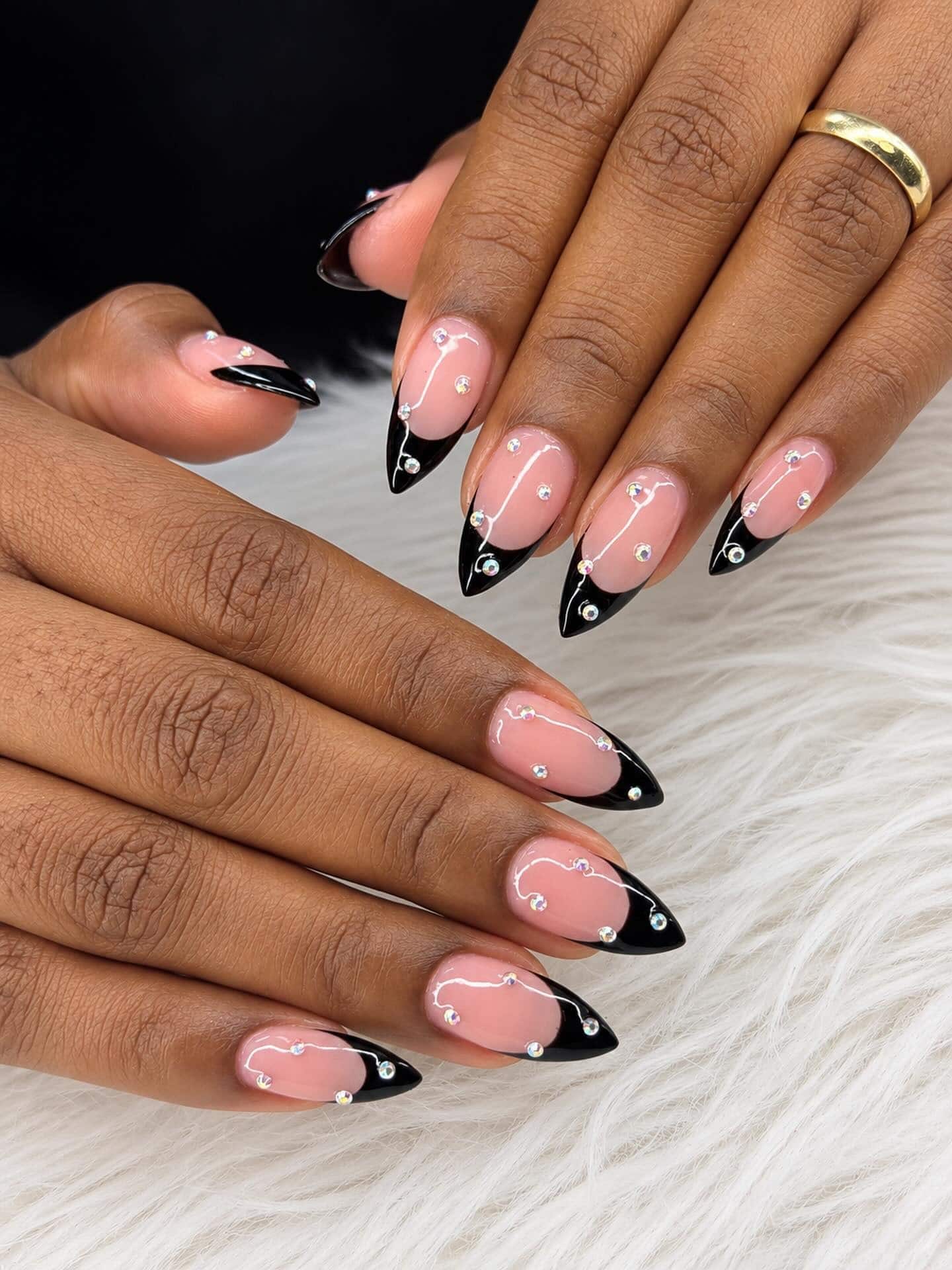 6. Black French Stiletto Nails with Crystal Embellishments - black french nail ideas