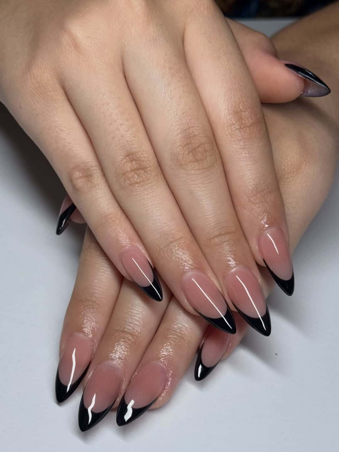 8. Elegant Black French Almond Nails with Rosy Nude Base - black french nail ideas