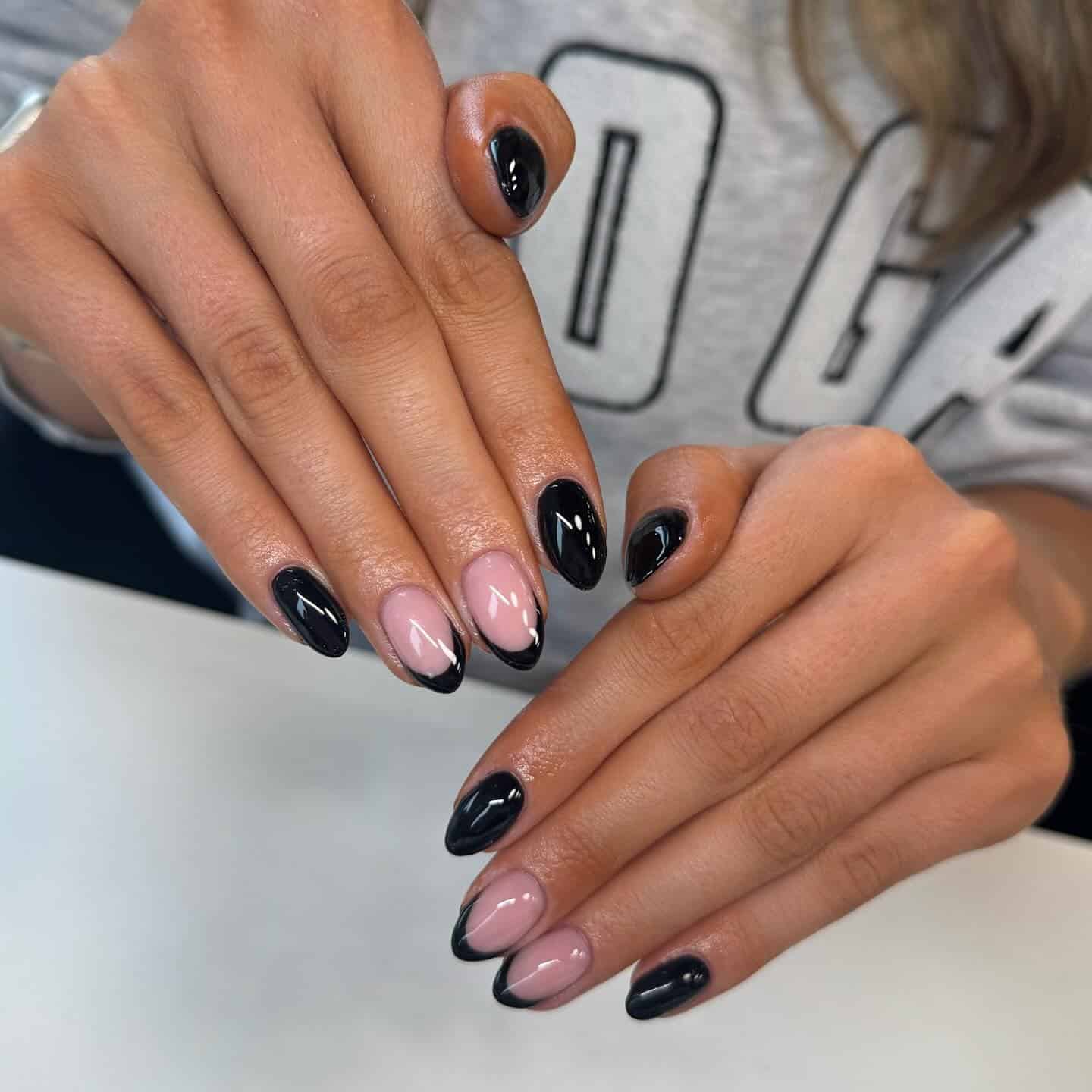 15. Black French Almond Nails with Solid Black Accents - black french nail ideas