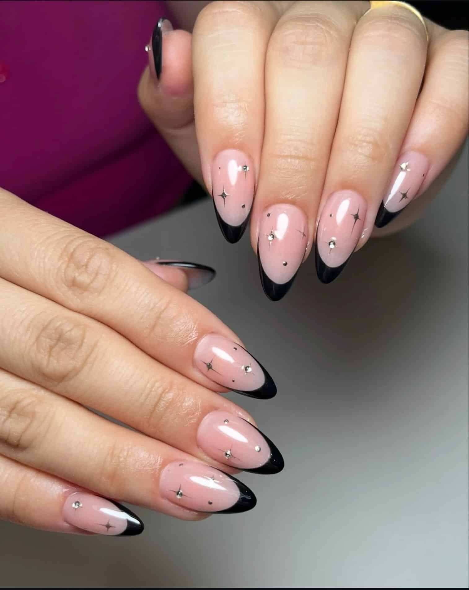 17. Black French Almond Nails with Silver Starburst Accents - black french nail ideas