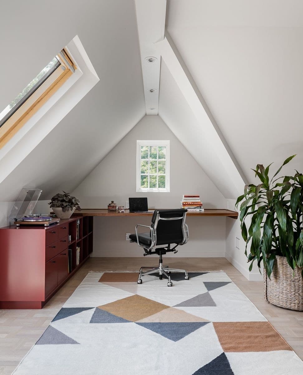 13. Contemporary White and Burgundy Attic Office with Geometric Rug - attic office ideas
