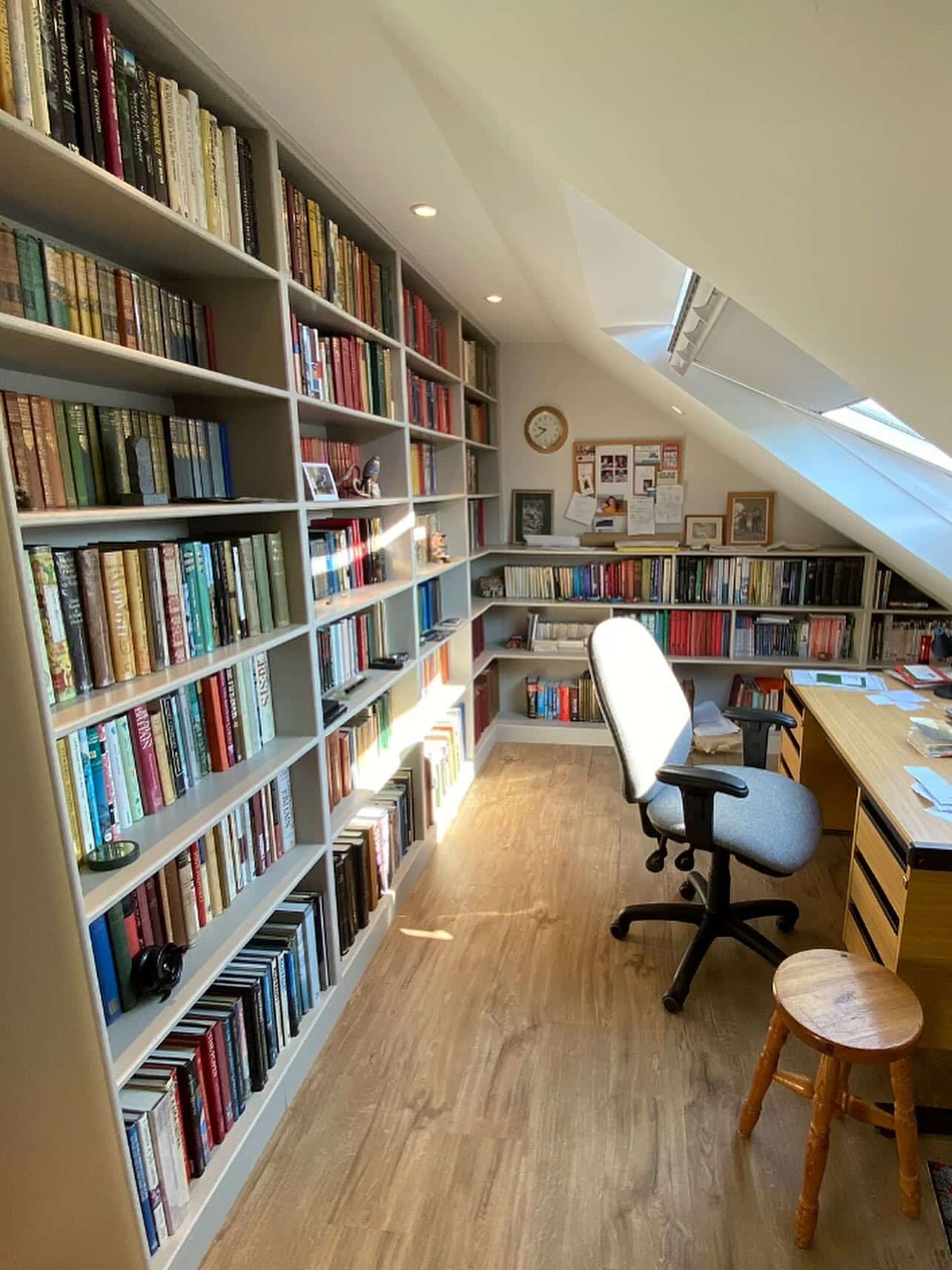 18. Classic White and Natural Oak Attic Office with Floor-to-Ceiling Library - attic office ideas