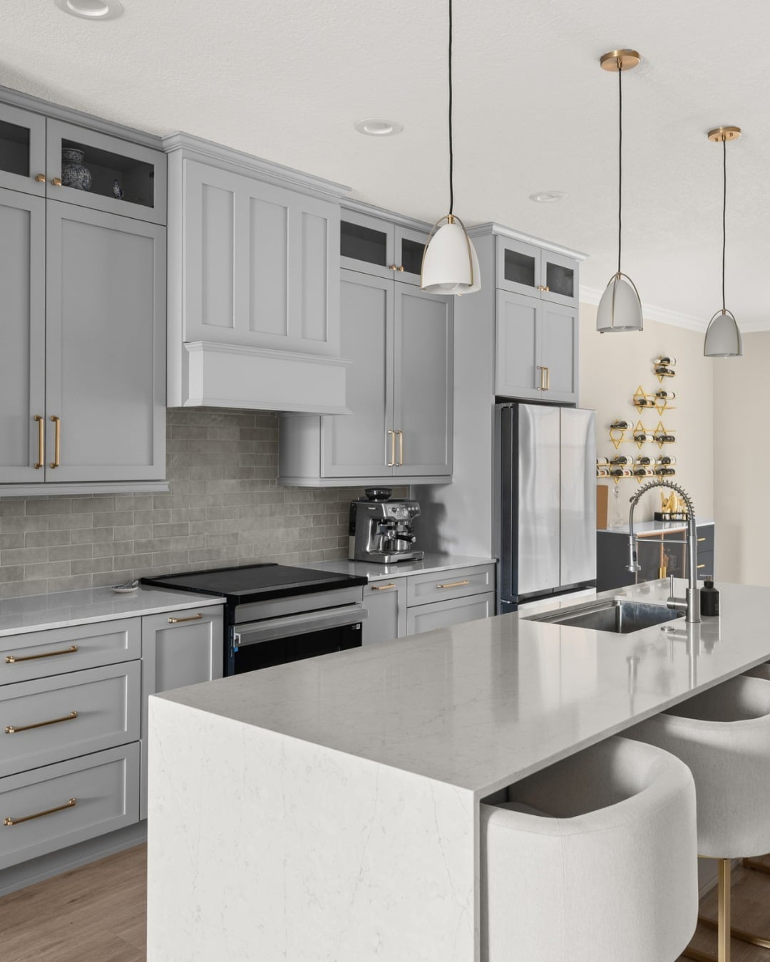 12. Elegant Light Grey Kitchen Cabinets with Gold Hardware - grey cabinet kitchen ideas