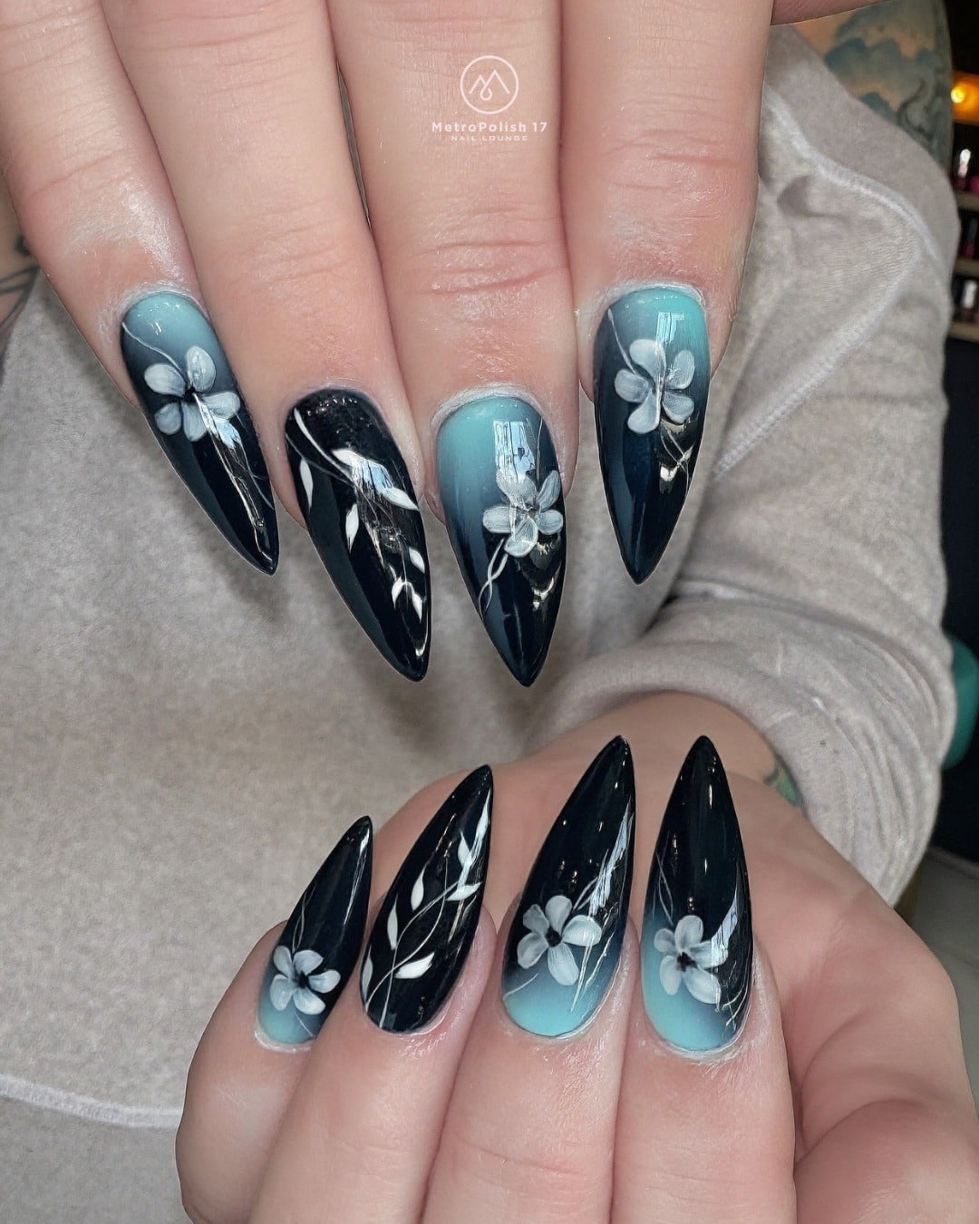 4. Black and Teal Blue Floral Stiletto Nails - blue and black nail ideas