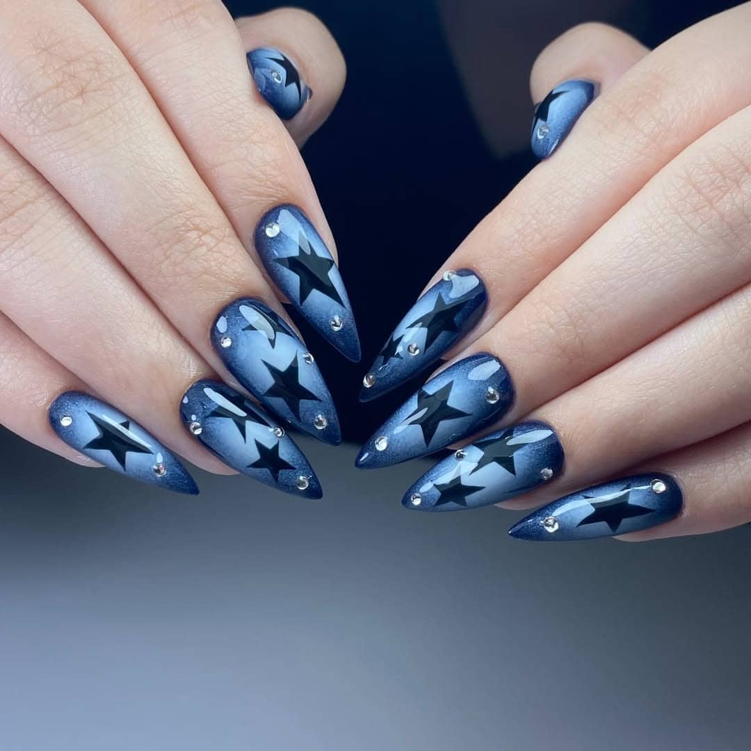 11. Midnight Blue and Black Star Stiletto Nails - blue and black nail ideas