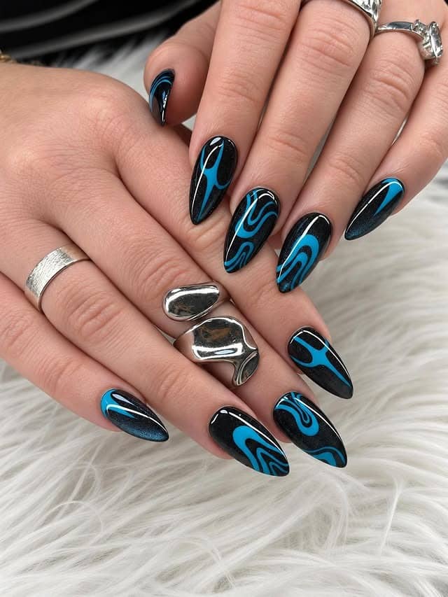 15. Electric Blue and Black Swirl Almond Nails - blue and black nail ideas