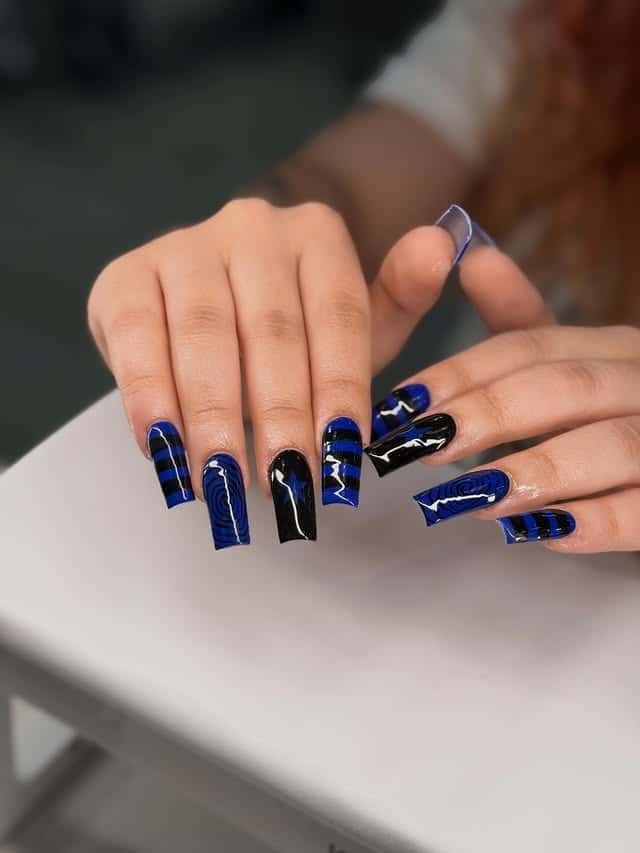 16. Royal Blue and Black Geometric Coffin Nails - blue and black nail ideas