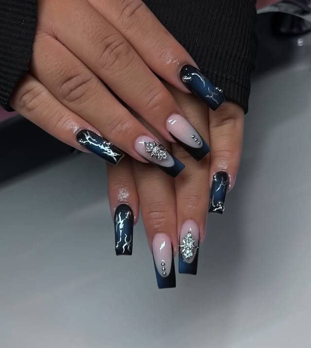 17. Navy Blue and Black French Coffin Nails with Silver Charms - blue and black nail ideas