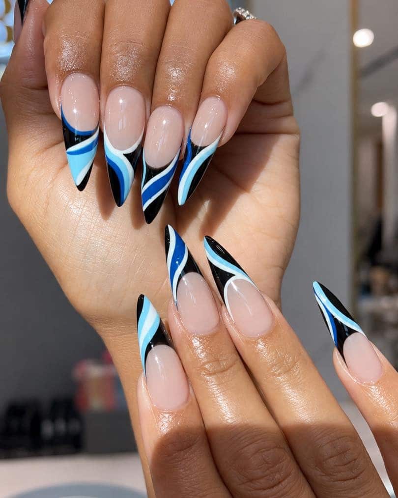 18. Black and Sky Blue Swirl French Stiletto Nails - blue and black nail ideas