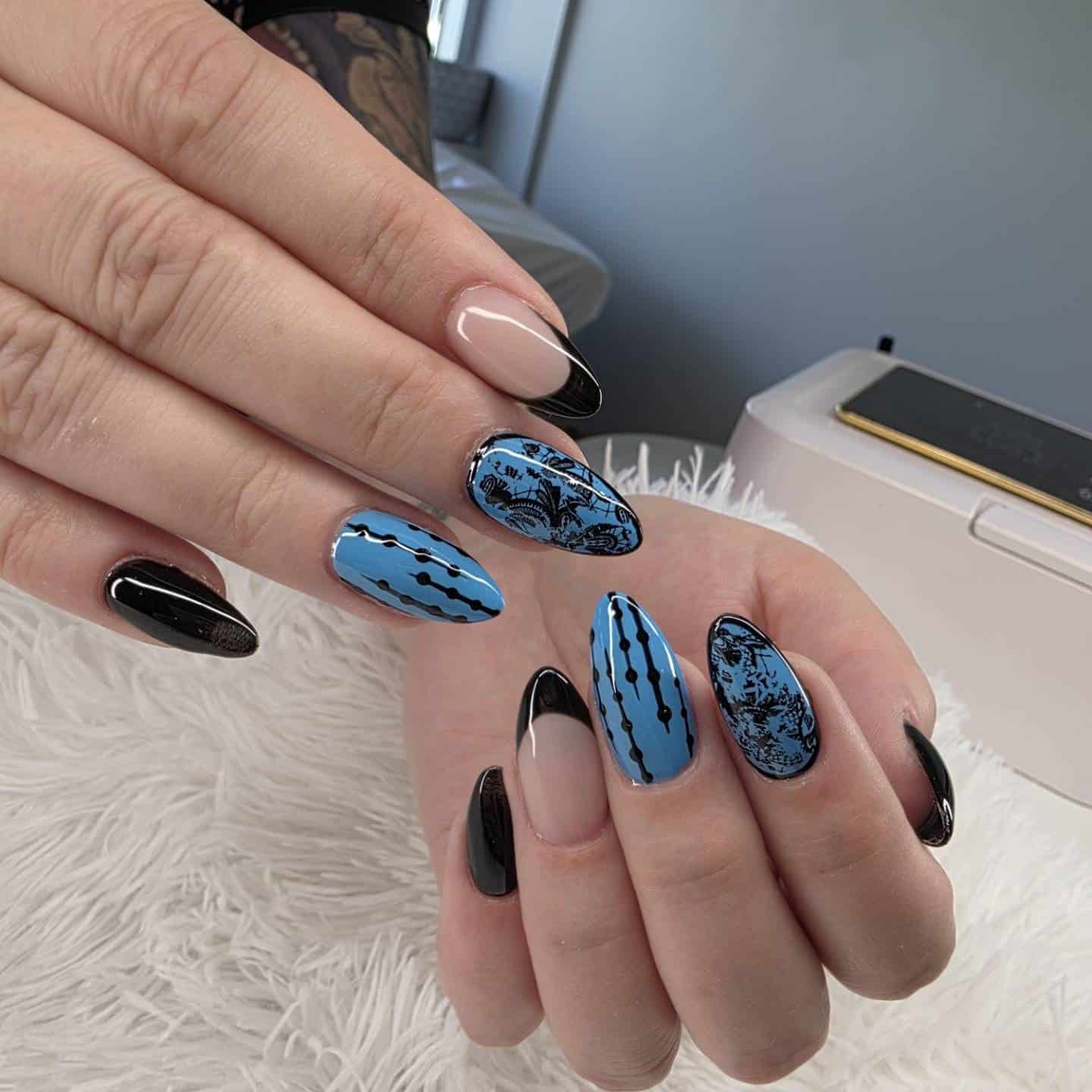 20. Powder Blue and Black Patterned Almond Nails - blue and black nail ideas