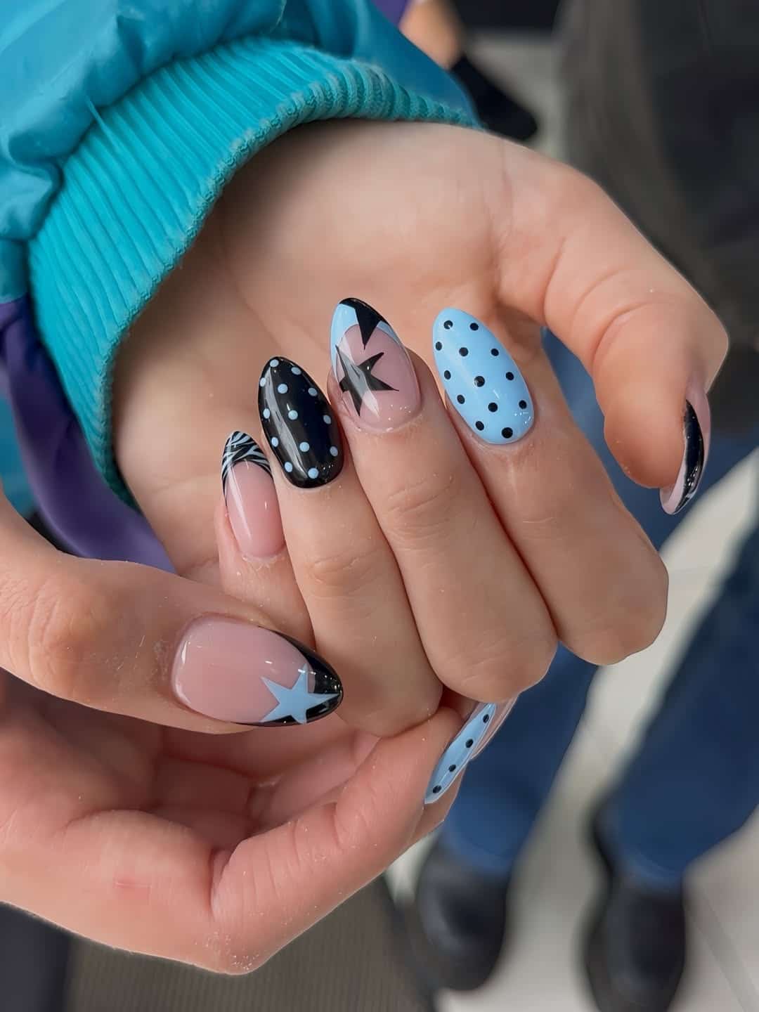 21. Baby Blue and Black Star and Polka Dot Almond Nails - blue and black nail ideas