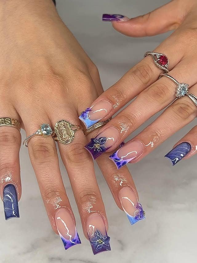 5. Deep Purple and Blue Floral French Tip Nails - blue and purple nail ideas