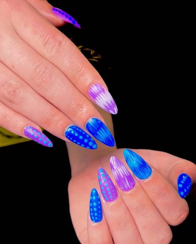 22. Electric Blue and Purple Polka Dot Stiletto Nails - blue and purple nail ideas