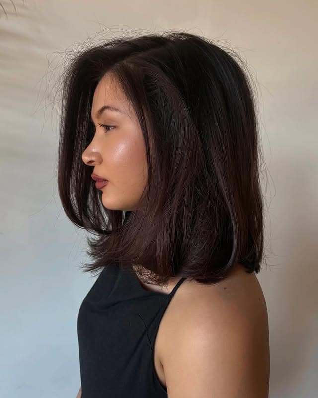 17. Deep Burgundy Brown Voluminous Lob with Side-Swept Layers - Lob Hairstyles