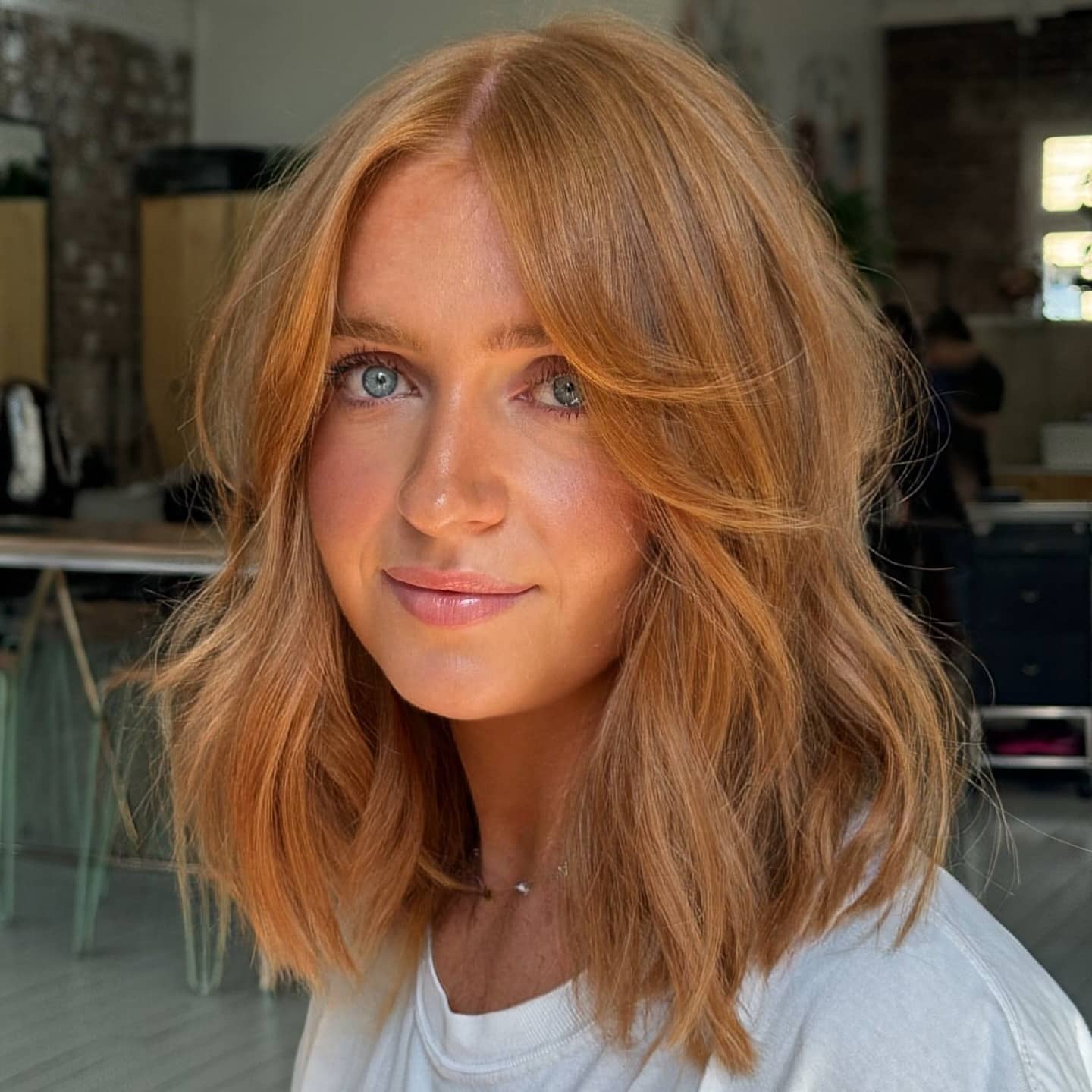 19. Strawberry Blonde Wavy Lob with Curtain Bangs - Lob Hairstyles