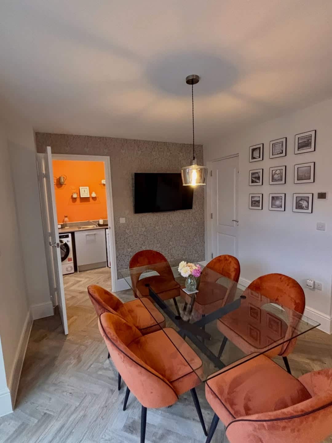2. Soft Gray Kitchen Dining Feature Wall with Burnt Orange Accents - feature wall kitchen ideas