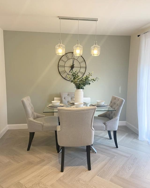 3. Sage Gray Kitchen Dining Feature Wall with Black Clock Decor - feature wall kitchen ideas