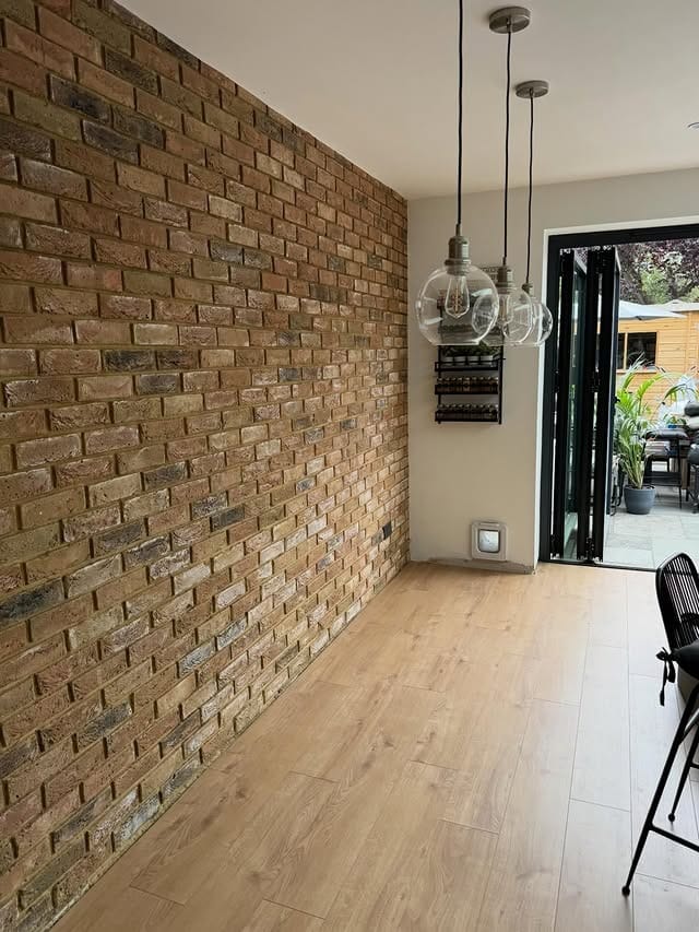 4. Rustic Brown Exposed Brick Kitchen Feature Wall with Natural Wood Flooring - feature wall kitchen ideas
