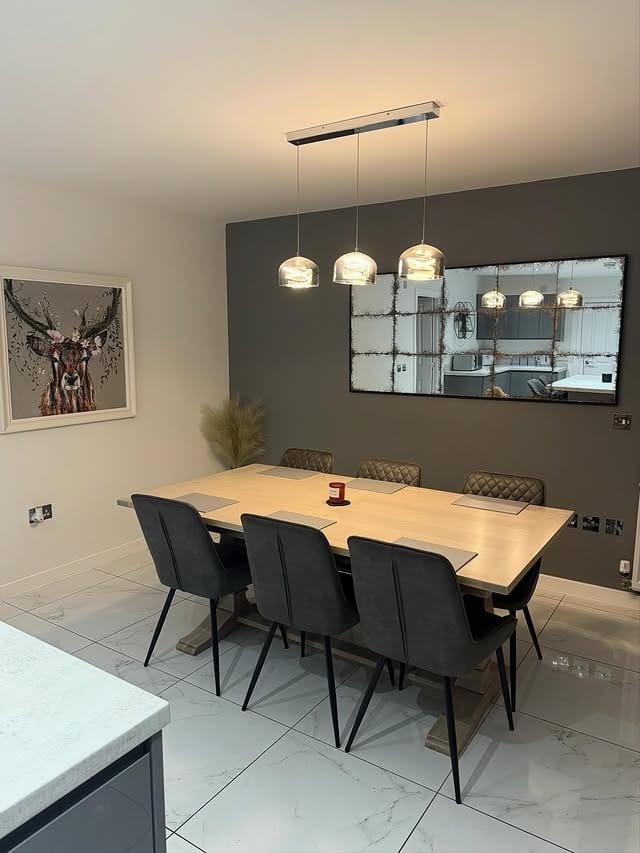 9. Charcoal Gray Kitchen Dining Feature Wall with Antique Mirror Decor - feature wall kitchen ideas