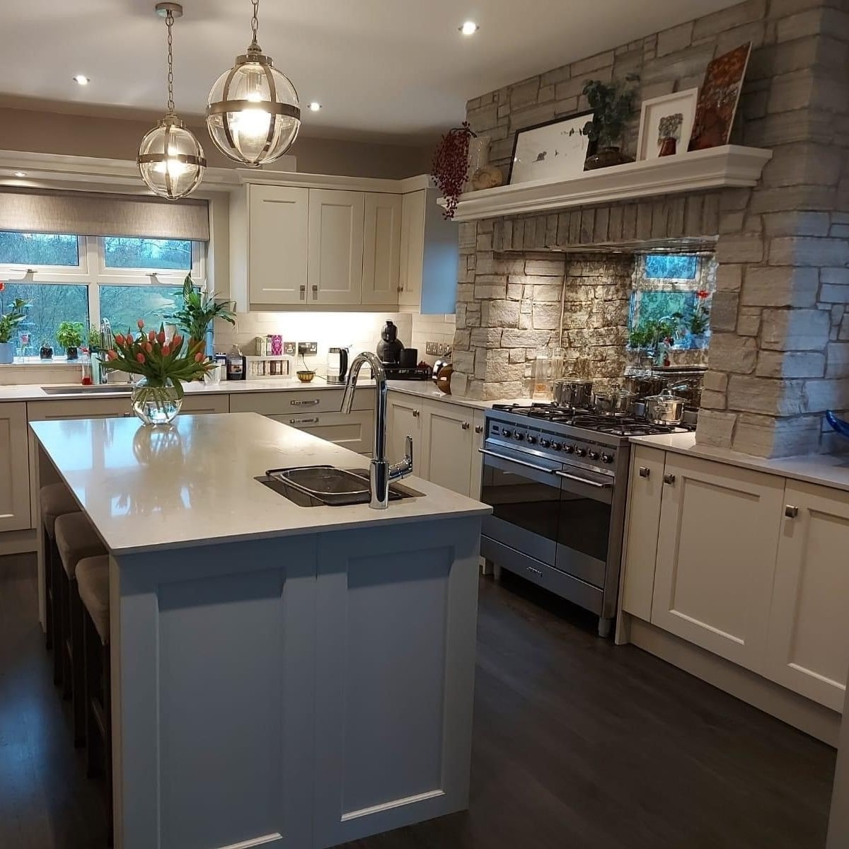 18. Rustic Gray Stone Kitchen Feature Wall with Cream Shaker Cabinets - feature wall kitchen ideas