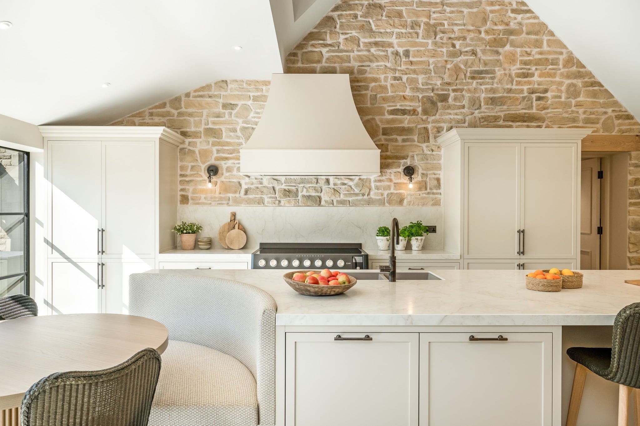 19. Warm Beige Natural Stone Kitchen Feature Wall with Cream Cabinets - feature wall kitchen ideas