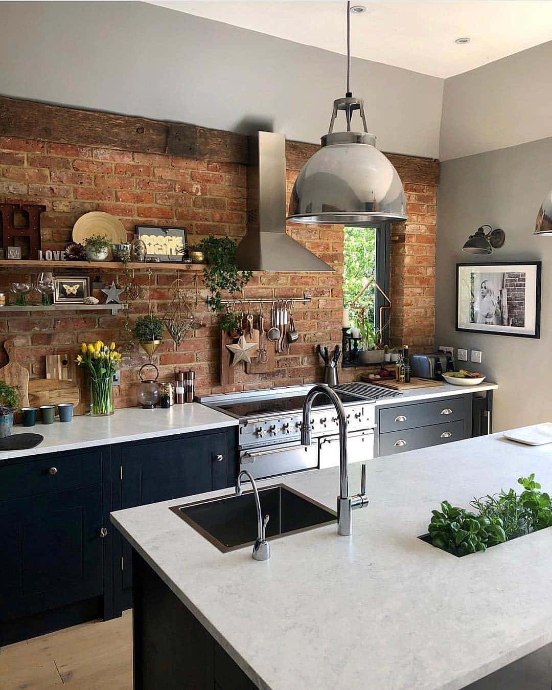 22. Rustic Red Brick Kitchen Feature Wall with Charcoal Gray Cabinets - feature wall kitchen ideas