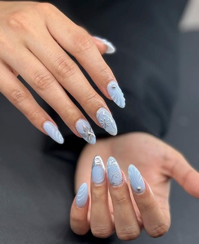 1. Icy Blue and Silver 3D Almond Nails - blue and silver nail ideas