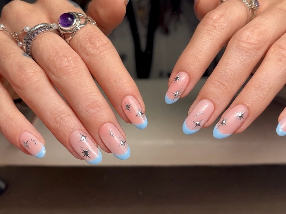 2. Baby Blue French Tip Nails with Silver Stars - blue and silver nail ideas