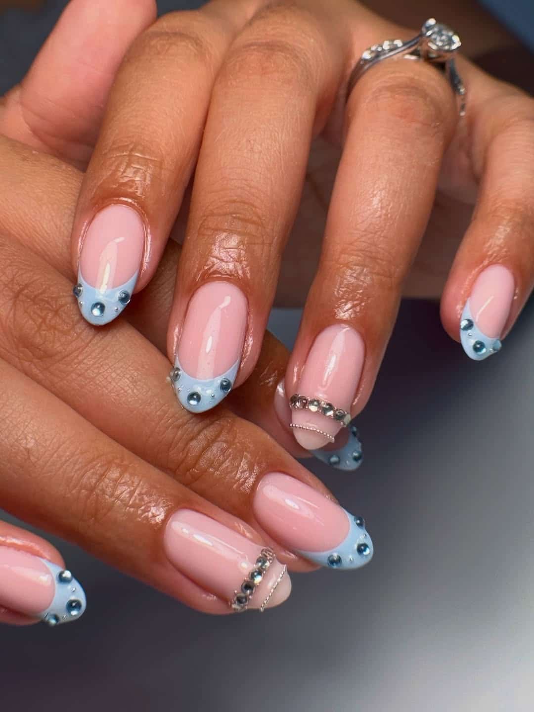 3. Light Blue French Tip Nails with Silver Rhinestones - blue and silver nail ideas