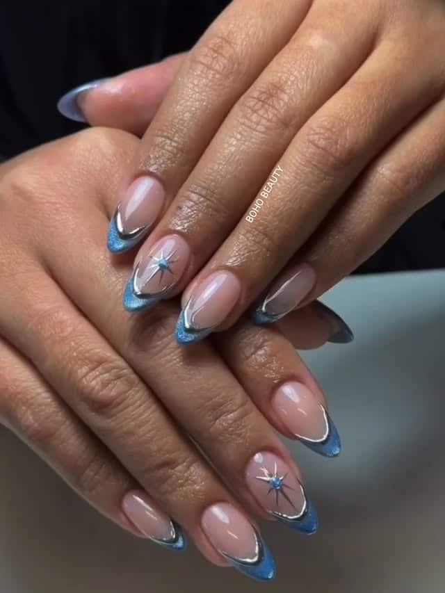 10. Steel Blue French Tip Nails with Silver Chrome Accents - blue and silver nail ideas