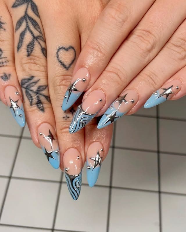 13. Baby Blue Stiletto Nails with 3D Silver Stars - blue and silver nail ideas