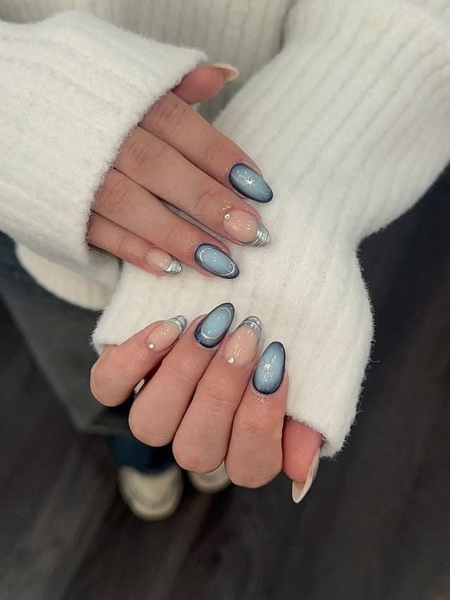 16. Dusty Blue Cat Eye Nails with Silver French Accents - blue and silver nail ideas