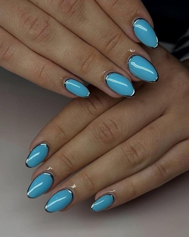 19. Sky Blue Almond Nails with Silver Chrome Outlines - blue and silver nail ideas