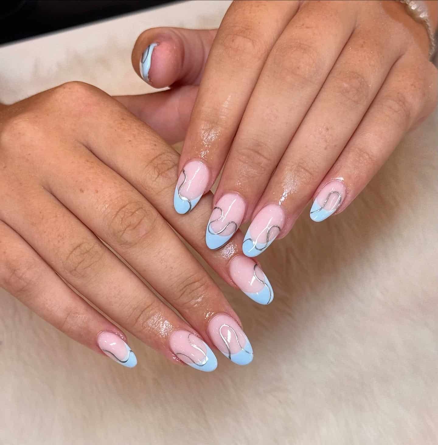 20. Pastel Blue French Tip Nails with Silver Swirls - blue and silver nail ideas