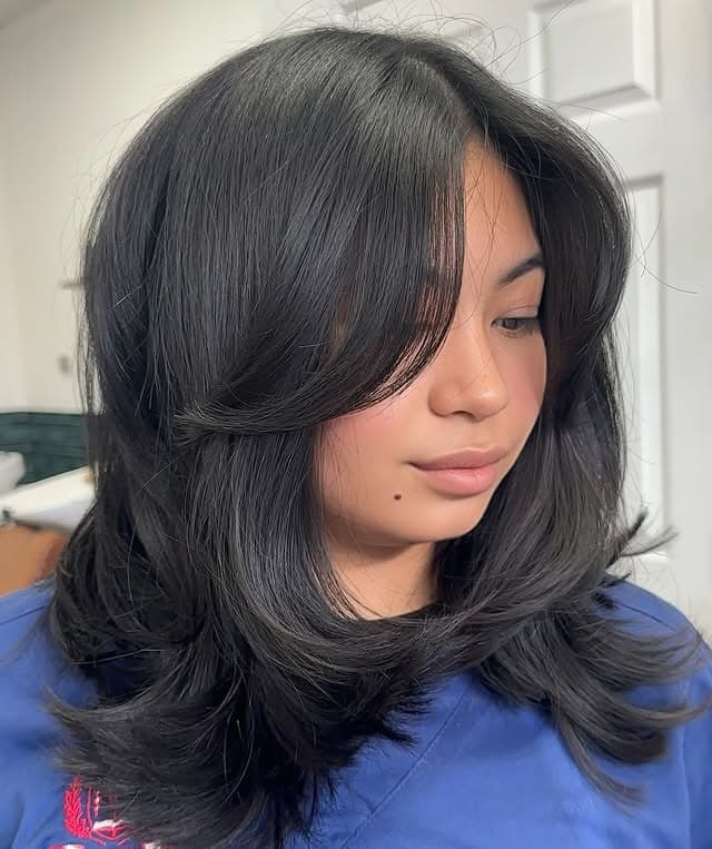7. Soft Black Short Layered Haircut with Curtain Bangs - Short Layered Haircuts