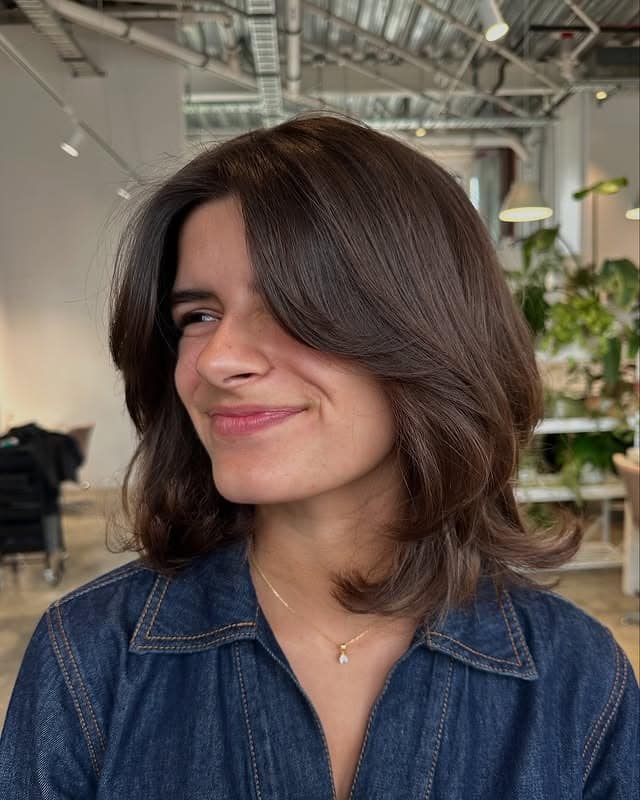 8. Chestnut Brown Layered Bob with Sweeping Bangs - Short Layered Haircuts