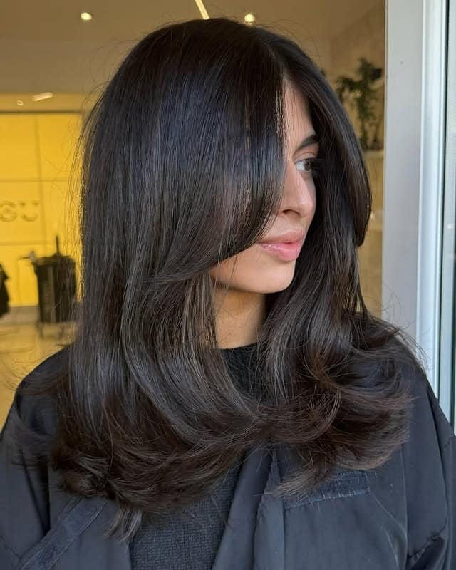 11. Glossy Soft Black Butterfly Cut with Face-Framing Layers - Short Layered Haircuts