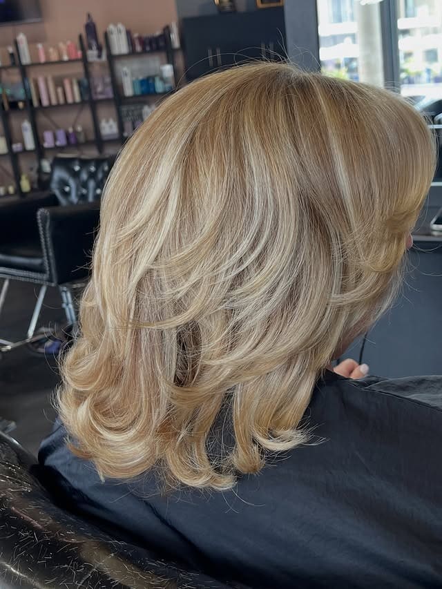 13. Champagne Blonde Feathered Bob with Flipped Ends - Short Layered Haircuts
