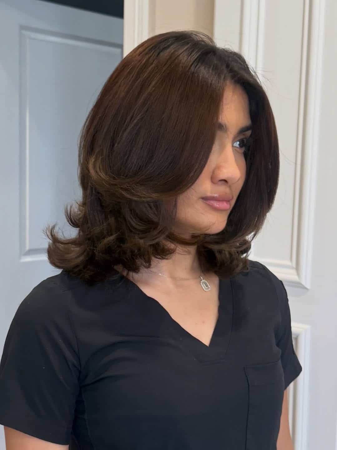20. Chocolate Brown Short Layered Bob with Side-Swept Bangs - Short Layered Haircuts