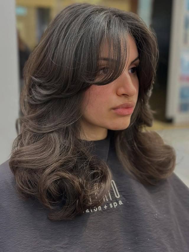 21. Smoky Ash Brown Butterfly Lob with Voluminous Curls - Short Layered Haircuts