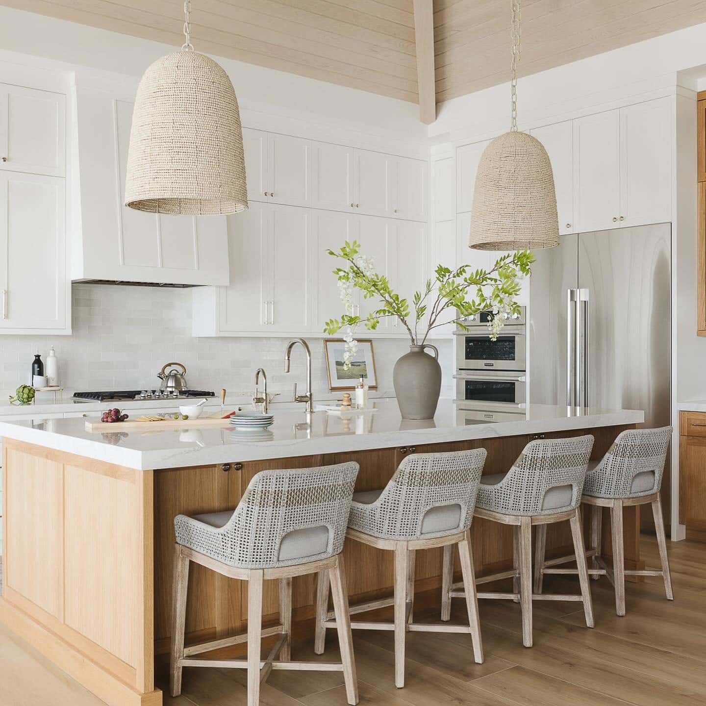 7. Coastal White Kitchen with Light Oak Island - all white kitchen ideas
