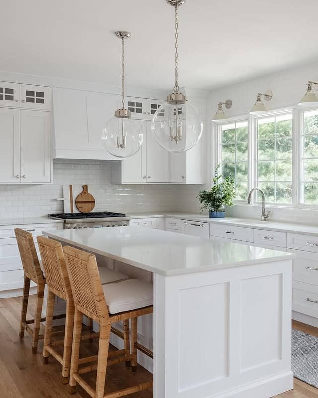 17. Traditional White Kitchen with Glass Globe Pendants - all white kitchen ideas