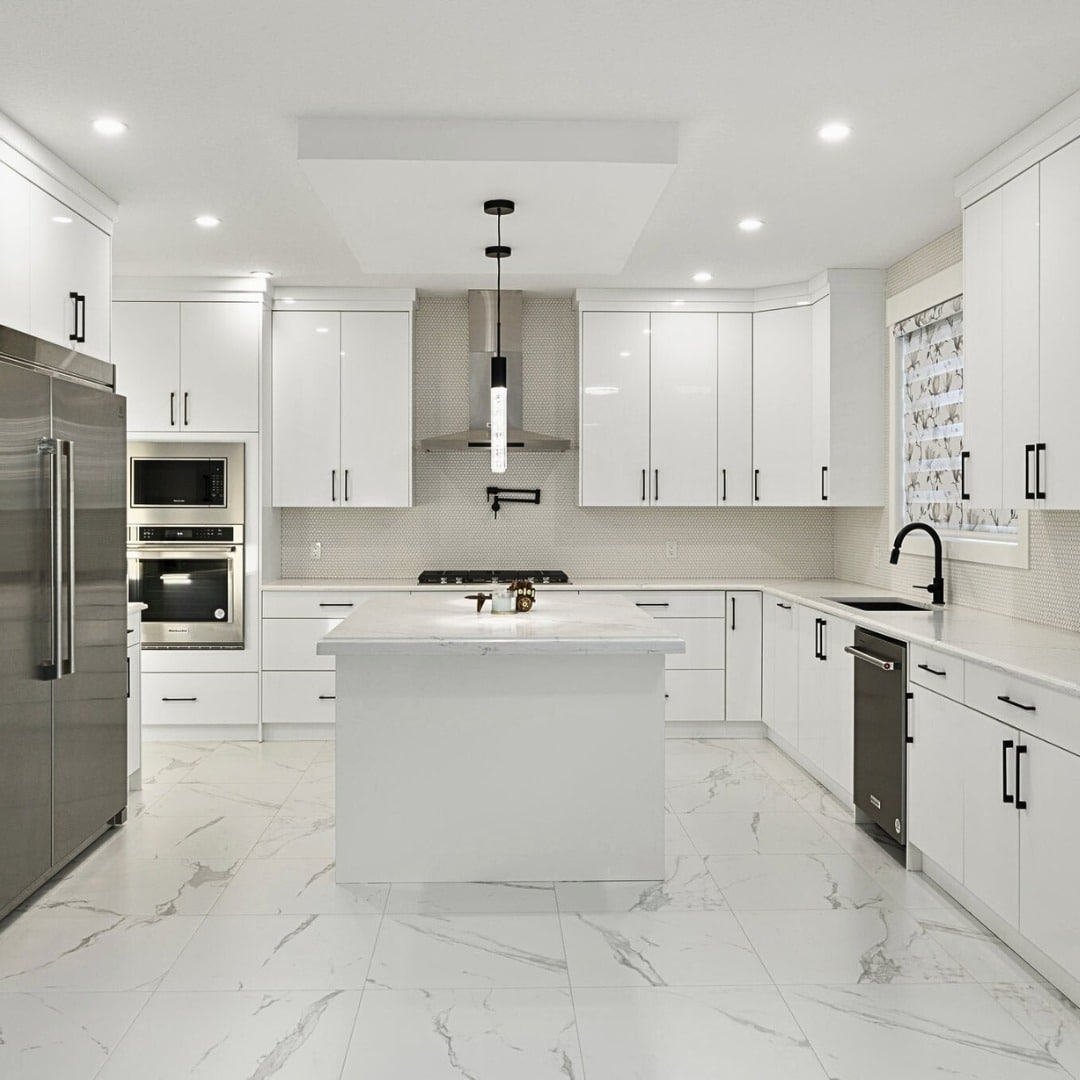 21. Modern All White Kitchen with Black Hardware and Marble Flooring - all white kitchen ideas